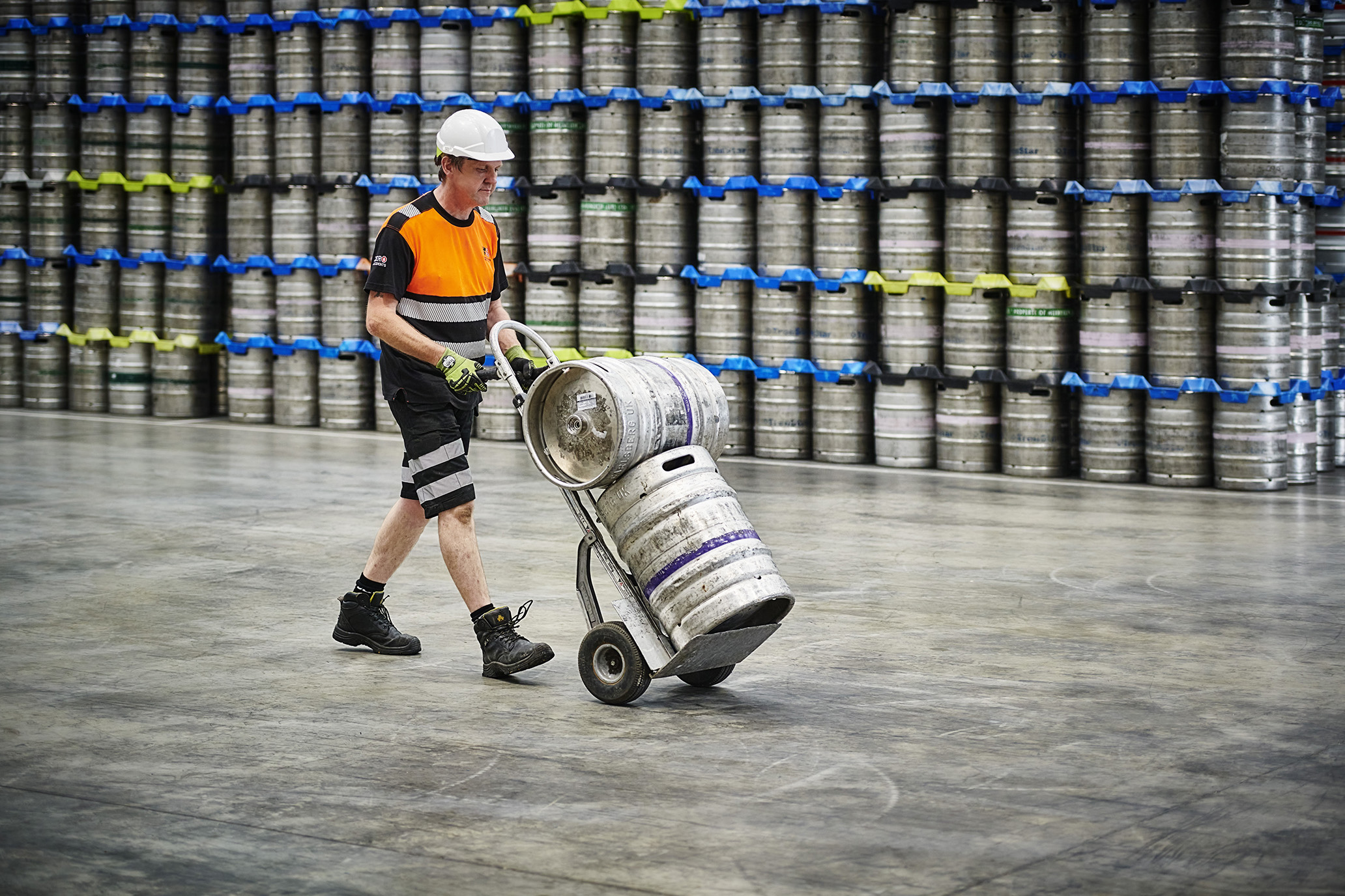 Person with kegs on trolley 2.jpg