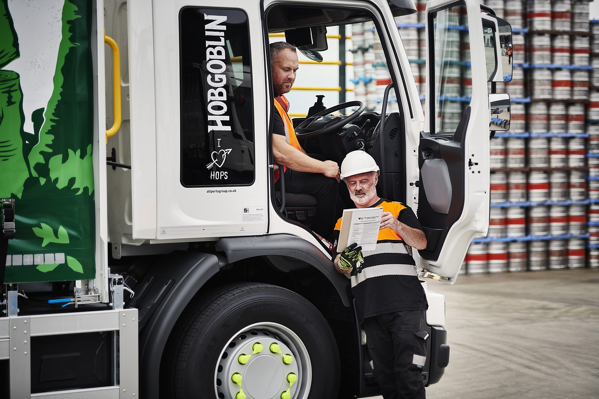 Two people traing by truck.jpg